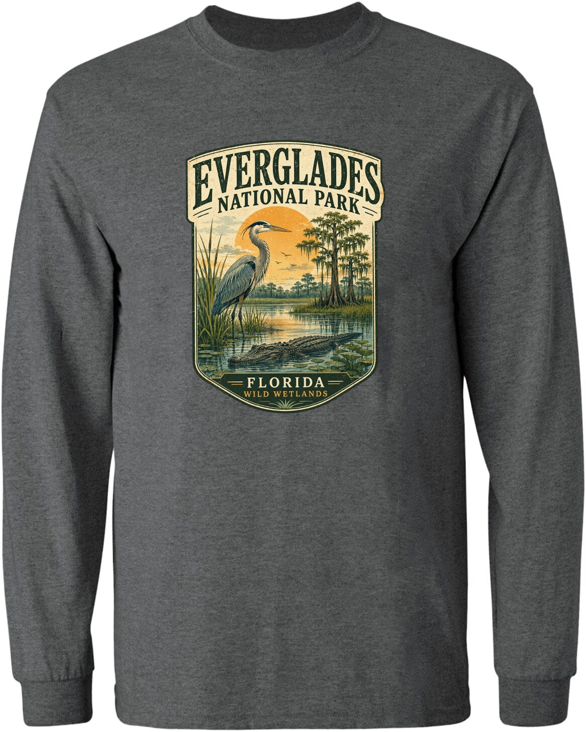 A gray long-sleeved t-shirt with a graphic design depicting a bird standing in a marshy area with trees and a body of water.