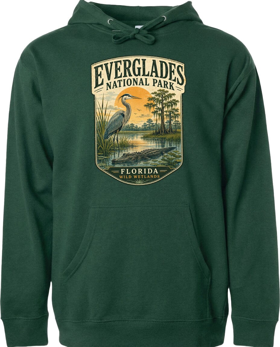 A green hoodie with a graphic design depicting a heron and a sunset over Everglades National Park, Florida.