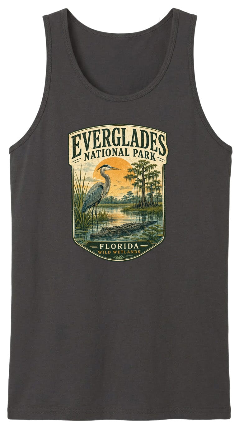 A black tank top with a graphic design depicting a bird standing in a marshy area with trees and a sunset in the background.
