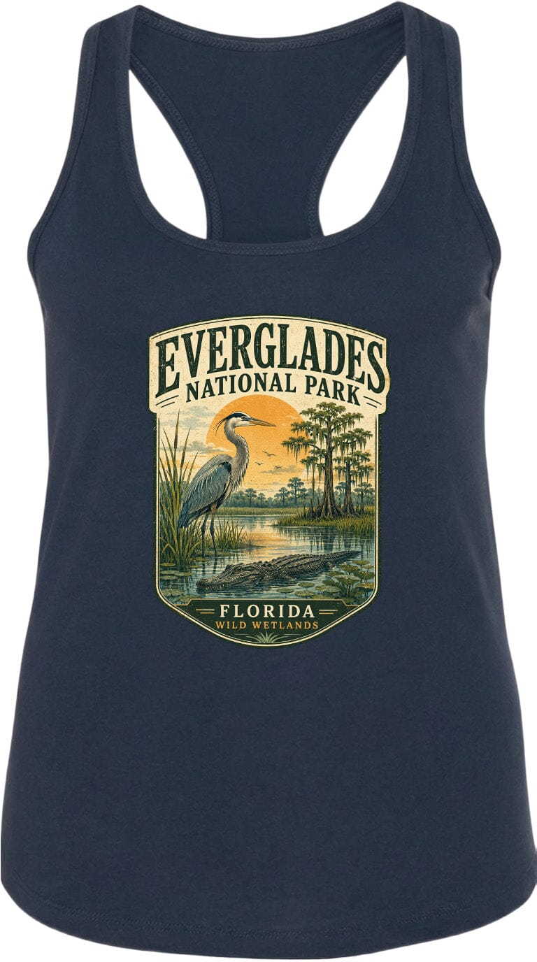 A navy blue tank top with a graphic design depicting a bird, a sunset, and a body of water, along with the text "EVERGLADES NATIONAL PARK FLORIDA WILDER".