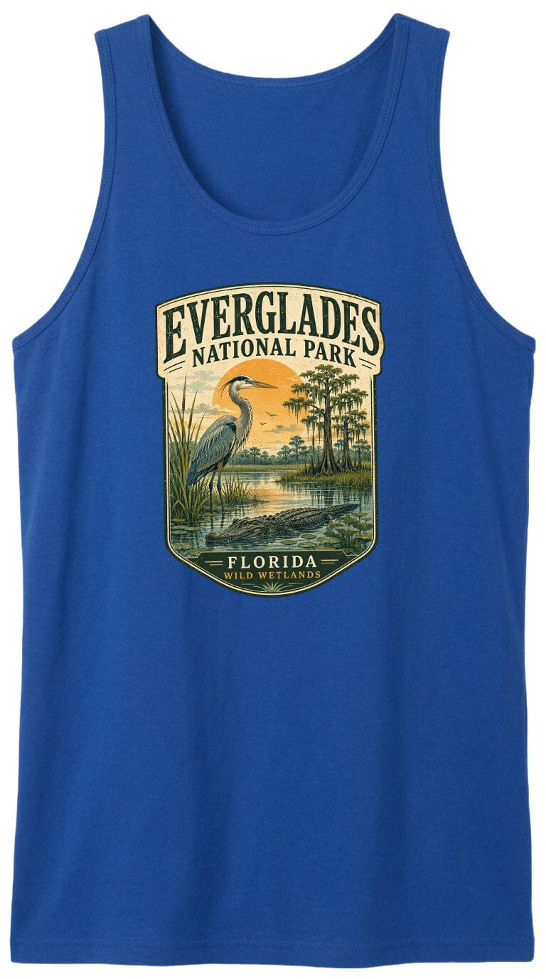 A blue tank top with a graphic design depicting a bird standing in a marshy area with trees and a sunset in the background.