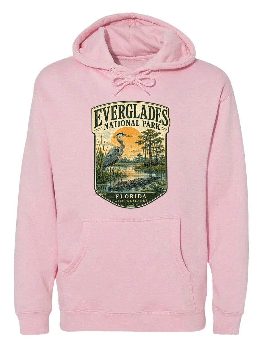 A pink hoodie with a graphic design depicting a bird and a landscape scene, along with the text "EVERGLADES NATIONAL PARK FLORIDA".