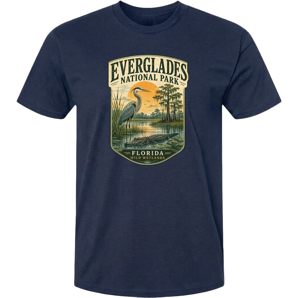 A navy blue t-shirt with a graphic design depicting a bird, a pond, and trees, along with the text "EVERGLADES NATIONAL PARK FLORIDA WILD WETLANDS".