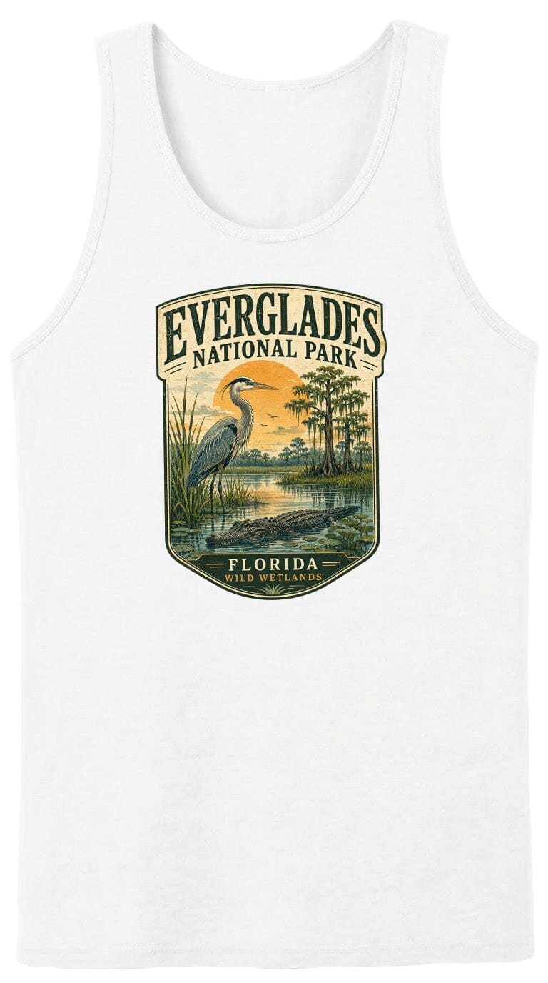 A white tank top with a graphic design depicting a bird standing in a marshy area with trees and a sunset in the background.
