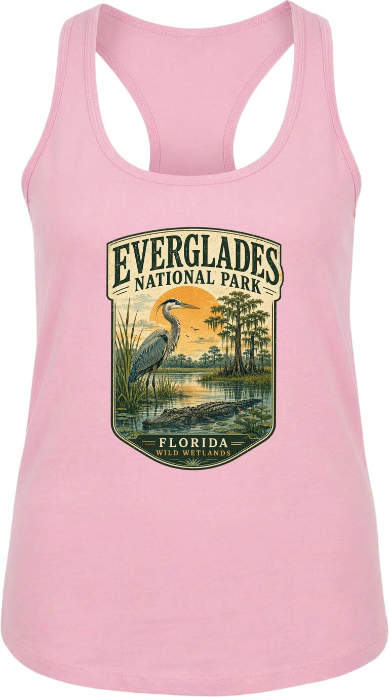 A pink tank top with a graphic design depicting a bird, a sunset, and a body of water, representing Everglades National Park in Florida.