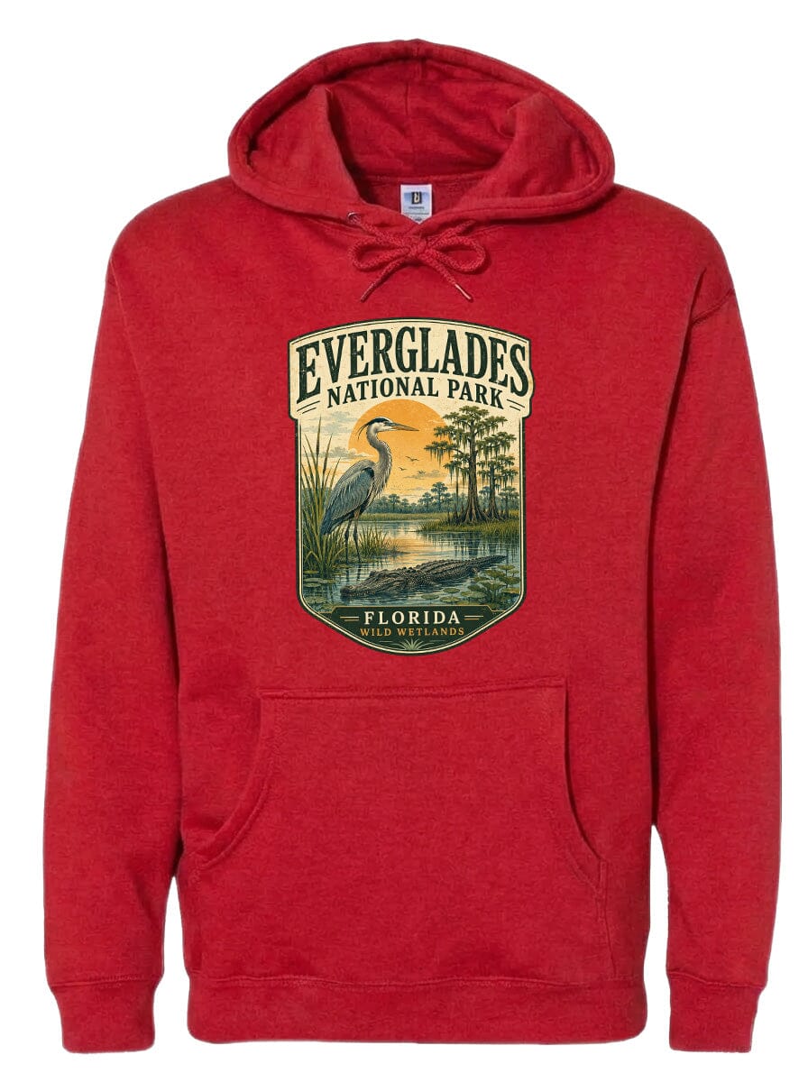 A red hooded sweatshirt with a graphic design depicting a bird and a landscape scene, along with the text "EVERGLADES NATIONAL PARK FLORIDA".