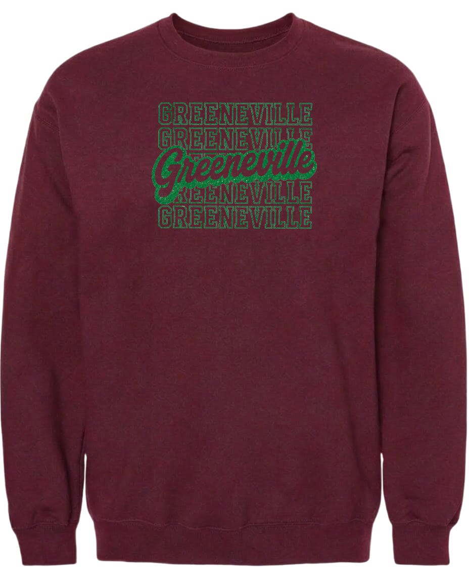 A burgundy sweatshirt with the text "Greeneville Greeneville Greeneville" printed in green on the front.