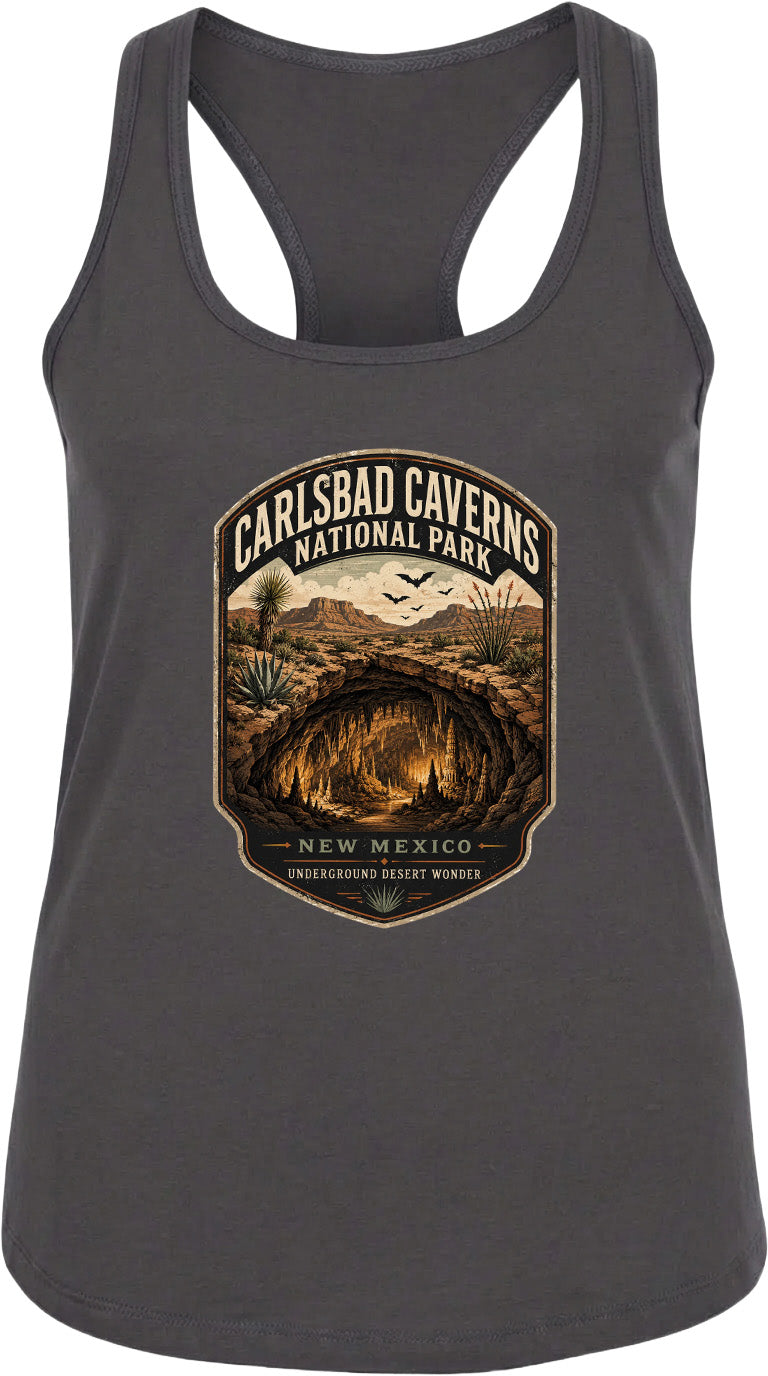 A gray tank top with a graphic design depicting the Carlsbad Caves National Park in New Mexico, featuring a desert landscape with a cave system and birds in the sky.