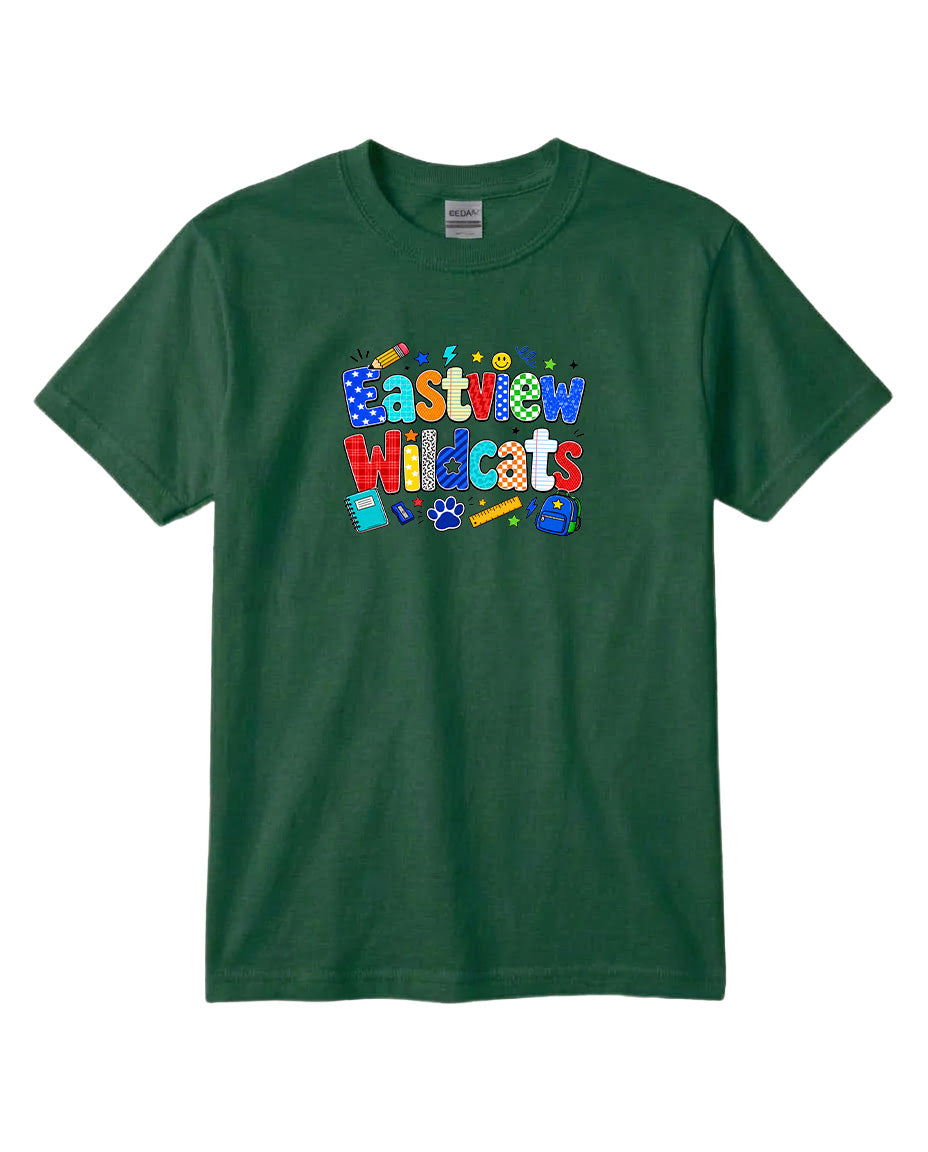 A green t-shirt with a colorful graphic design featuring the text "Eastview Wildcats" and various school supplies such as pencils, backpacks, and a globe.