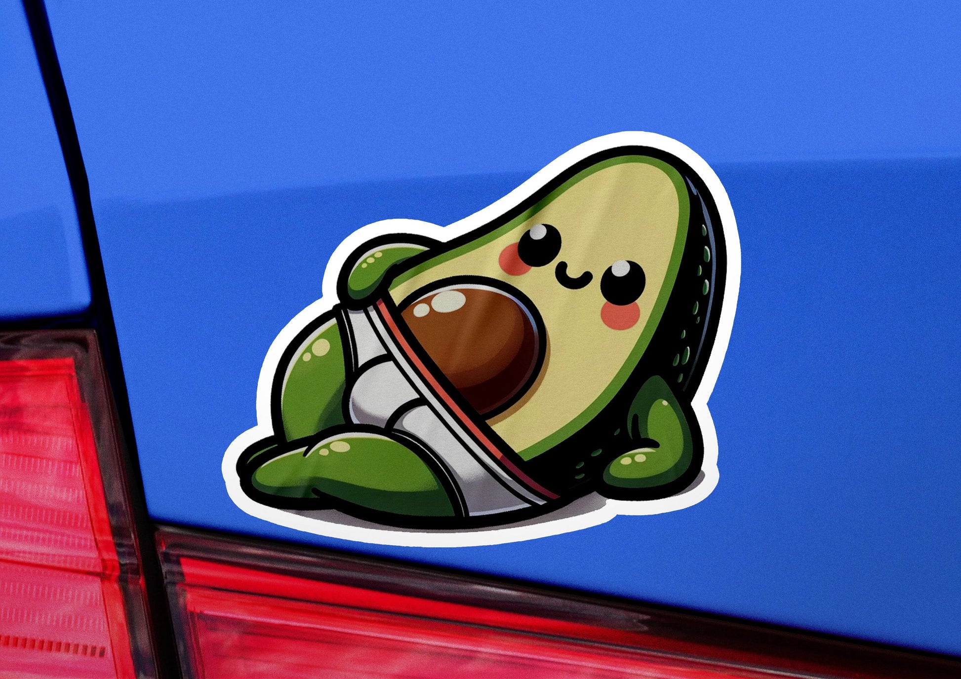 an avocado sticker on the back of a car