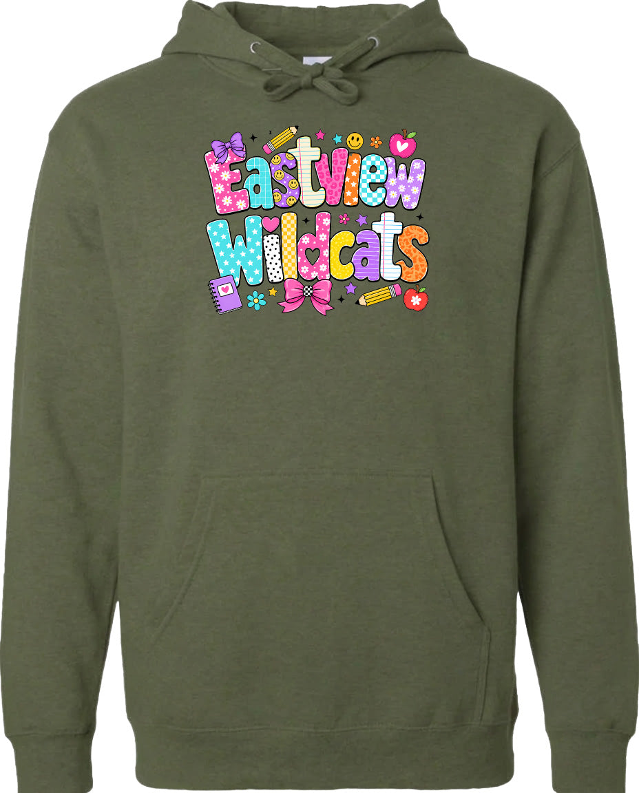 A green hoodie with a colorful graphic design featuring the text "Eastview Wildcats" and various decorative elements such as hearts, flowers, and pencils.
