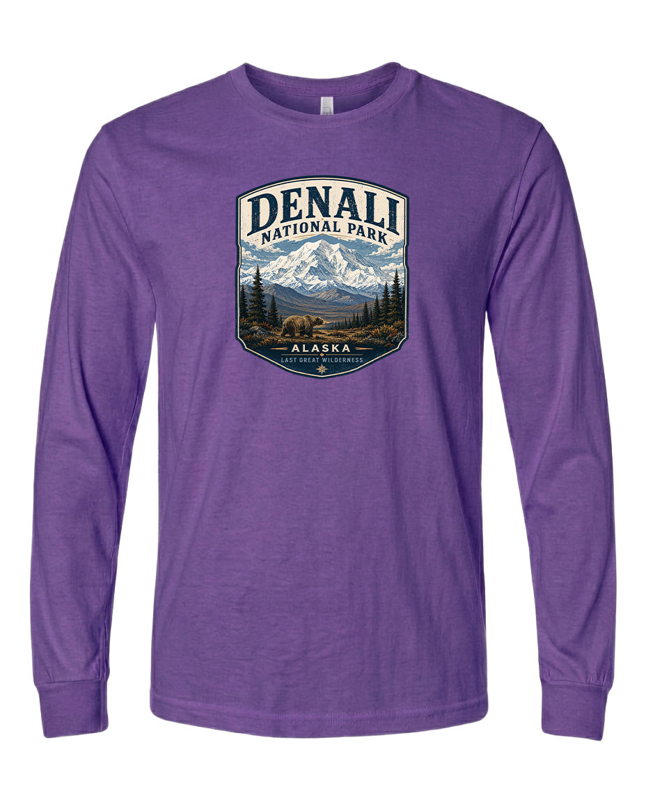 A purple long-sleeved t-shirt with a graphic design depicting Denali National Park in Alaska.