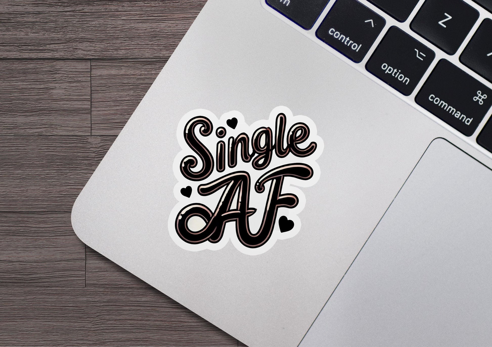 a sticker that says single af on a laptop