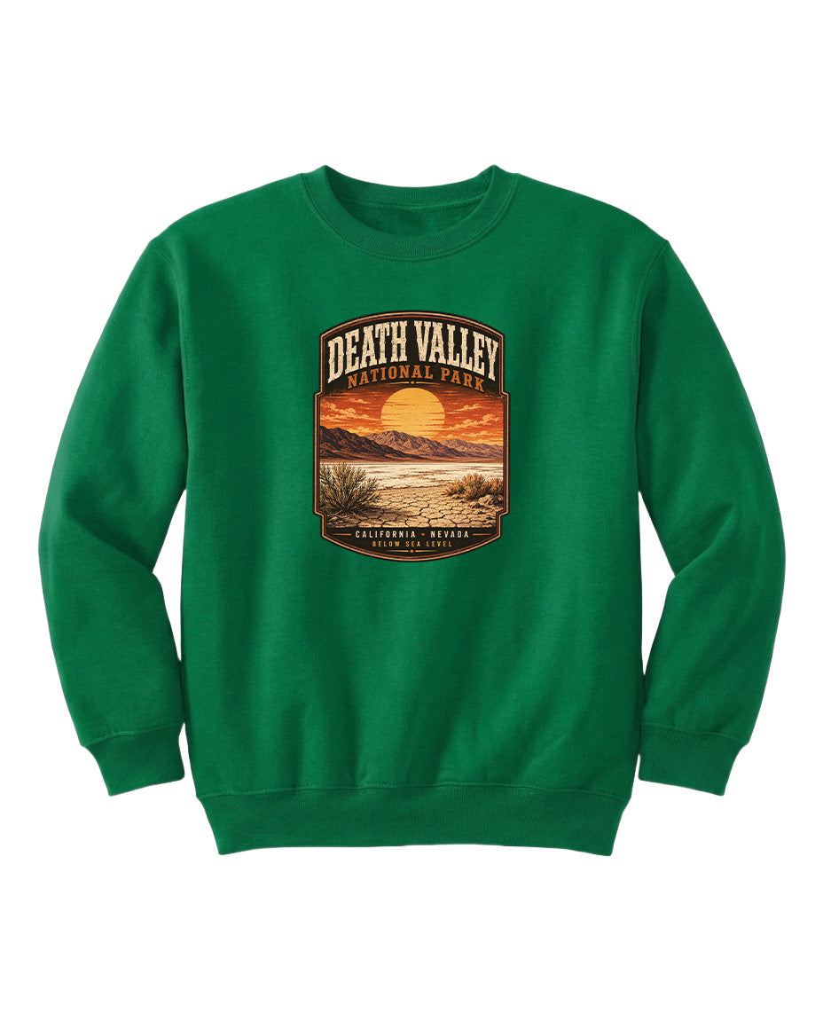 A green sweatshirt with a graphic design depicting a sunset over Death Valley National Park.