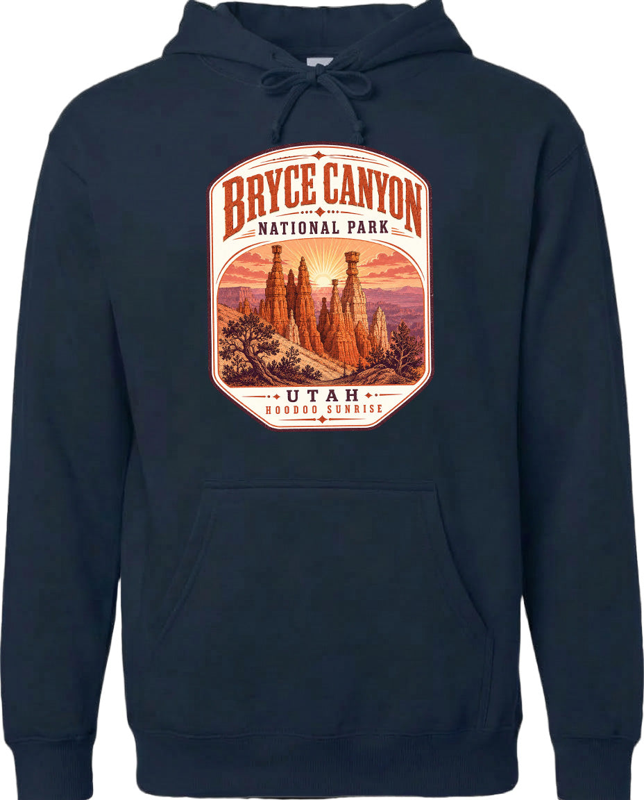 A navy blue hoodie with a graphic design depicting Bryce Canyon National Park and Utah, featuring a sunrise over the canyon.