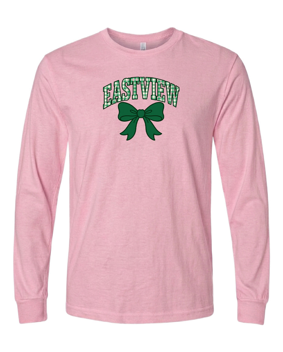 A pink long-sleeved t-shirt with a green bow and the word "EASTVIEW" printed on it.