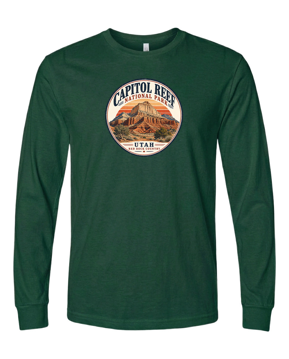 A green long-sleeved t-shirt with a circular design featuring the Capitol Reef National Park in Utah.