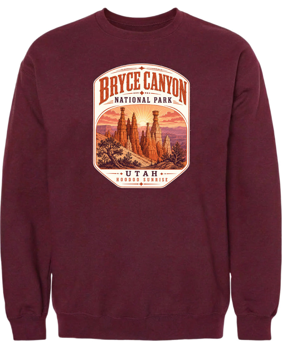 A burgundy-colored sweatshirt with a graphic design depicting the Bryce Canyon National Park in Utah.