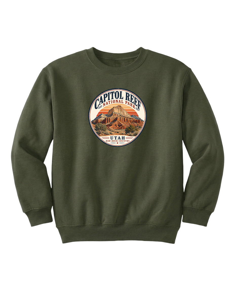 A dark green sweatshirt with a circular graphic design featuring the Capitol Reef National Park logo and the text "UTAH" printed on it.