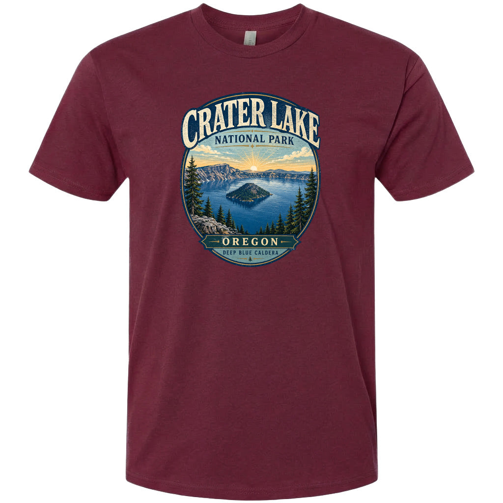 A maroon t-shirt with a graphic design depicting Crater Lake National Park in Oregon.