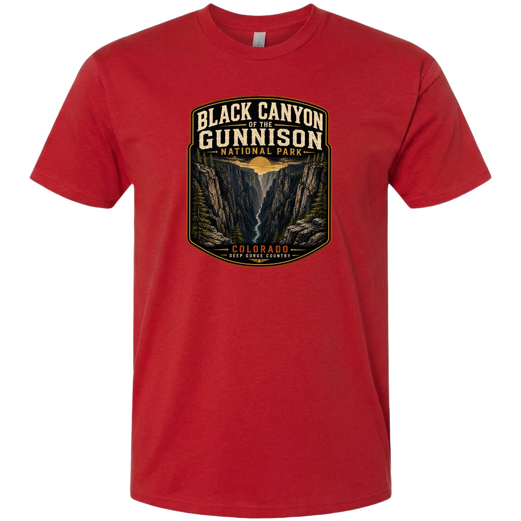A red t-shirt with a graphic design depicting the Black Canyon of the Gunnison National Park in Colorado.