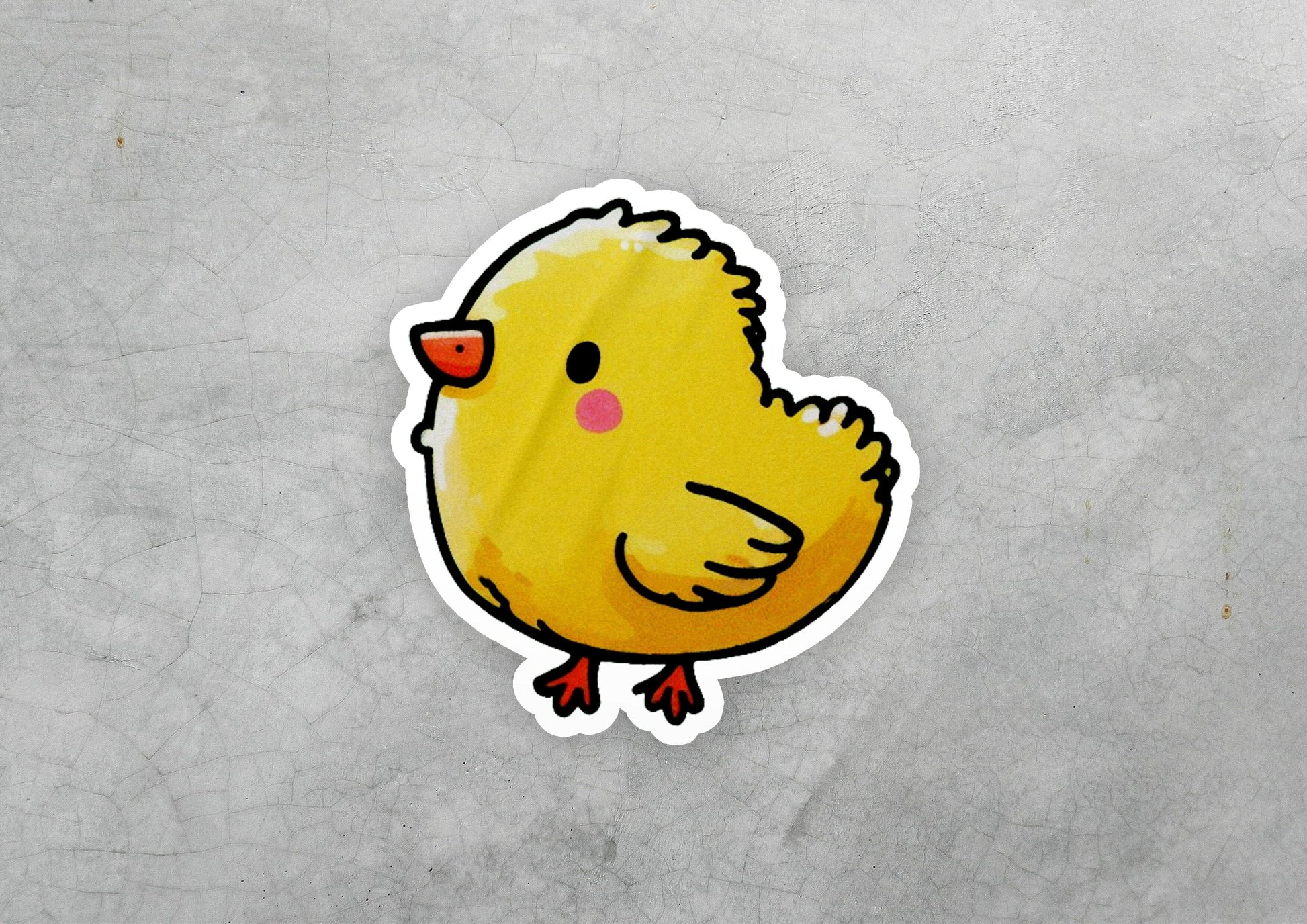 a sticker of a yellow chicken on a gray background