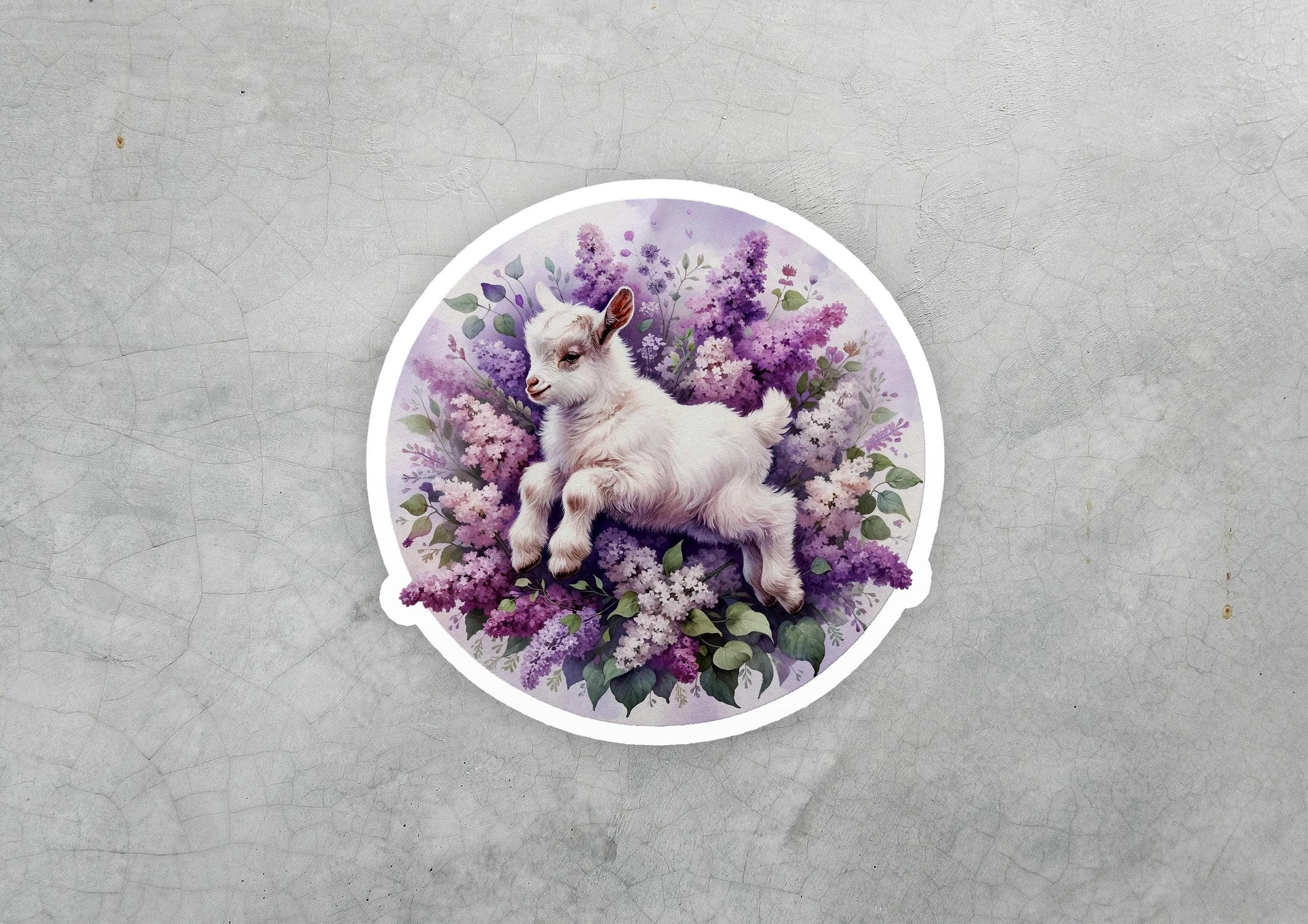 a sticker with a picture of a baby goat in a field of flowers