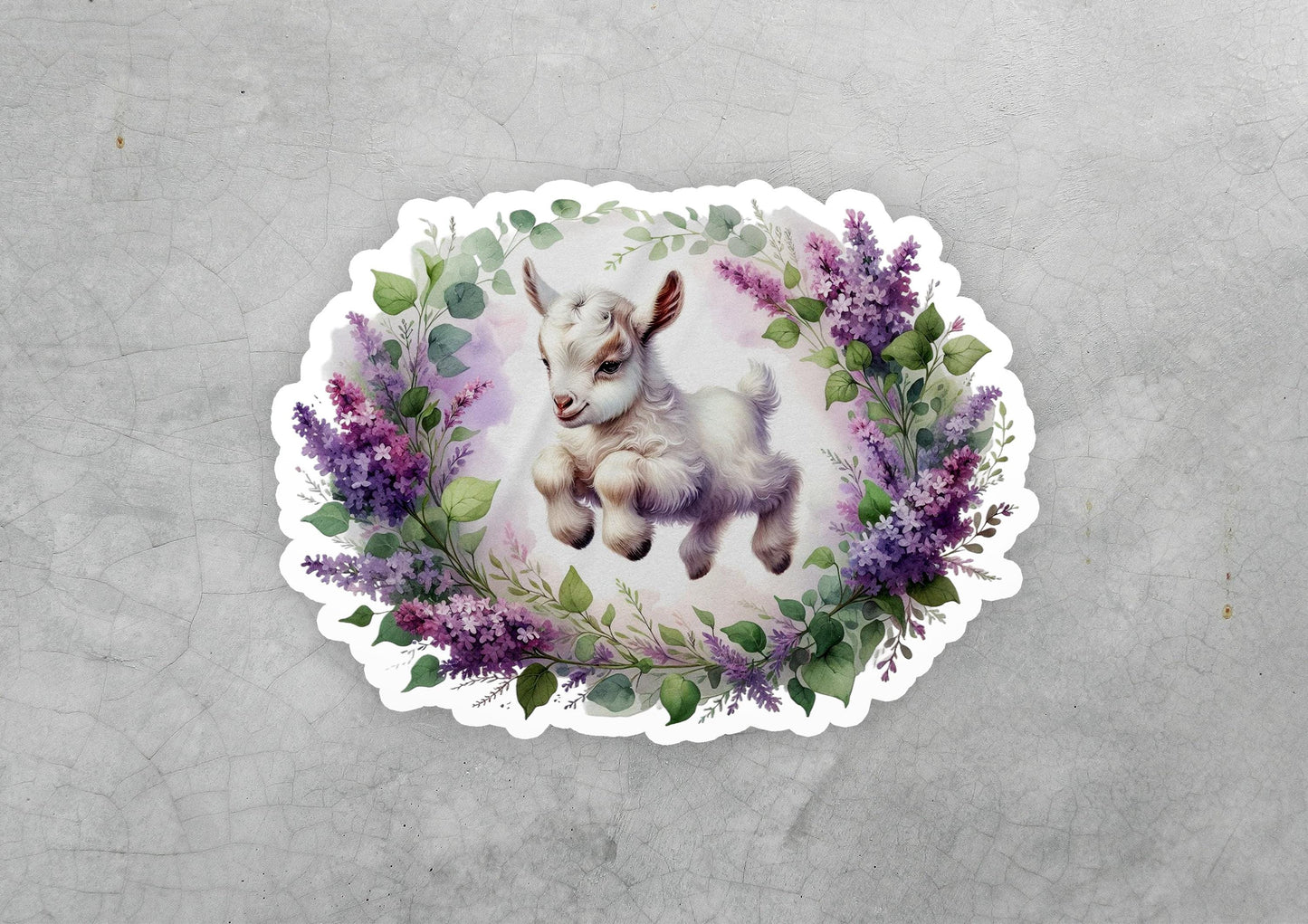 a sticker with a picture of a baby goat on it