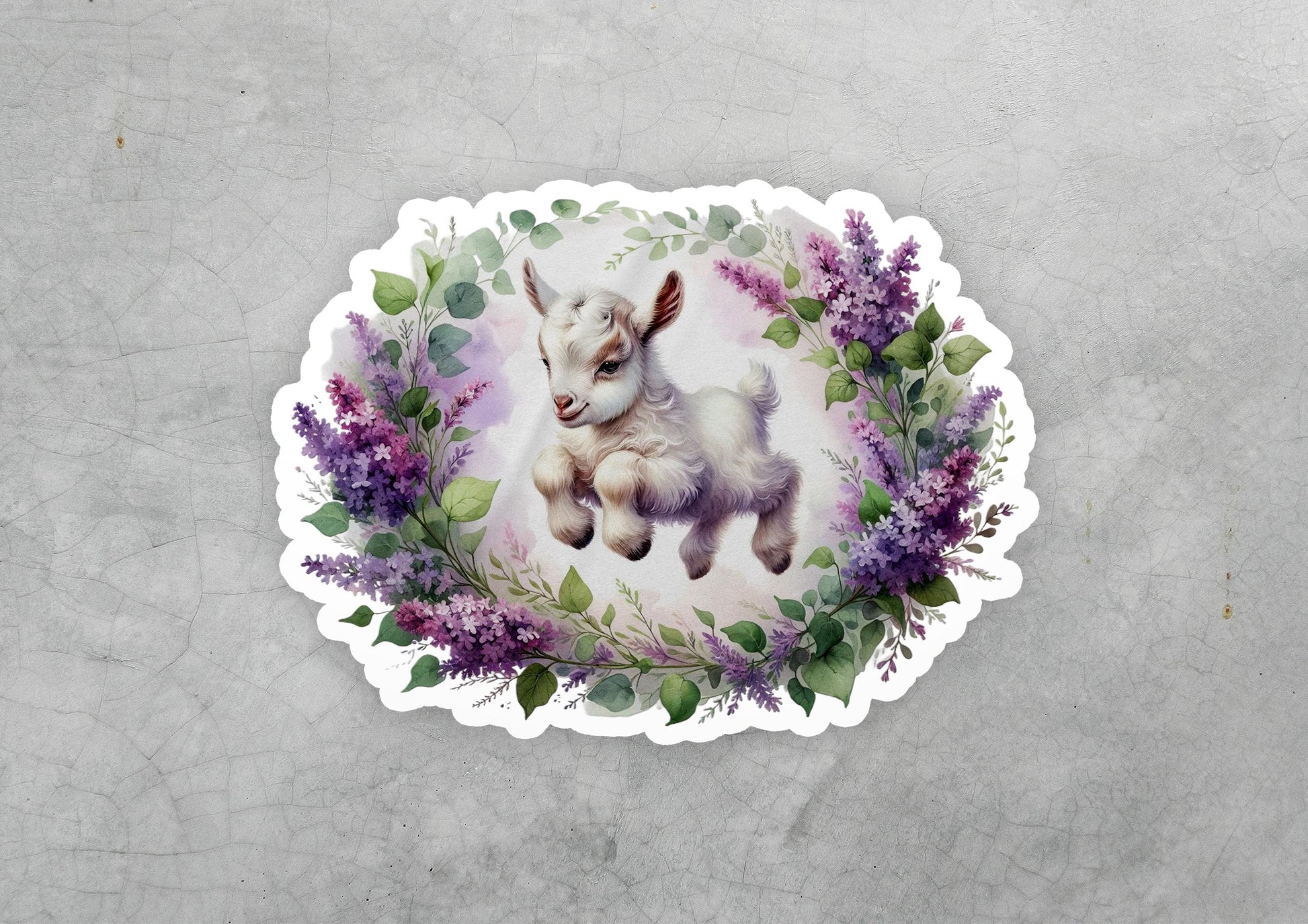 a sticker with a picture of a baby goat on it
