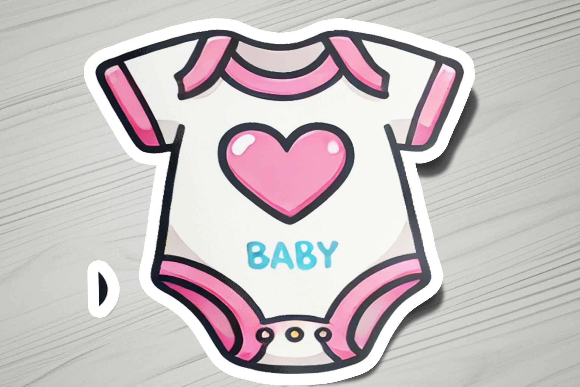 a baby onesuit with a heart on it