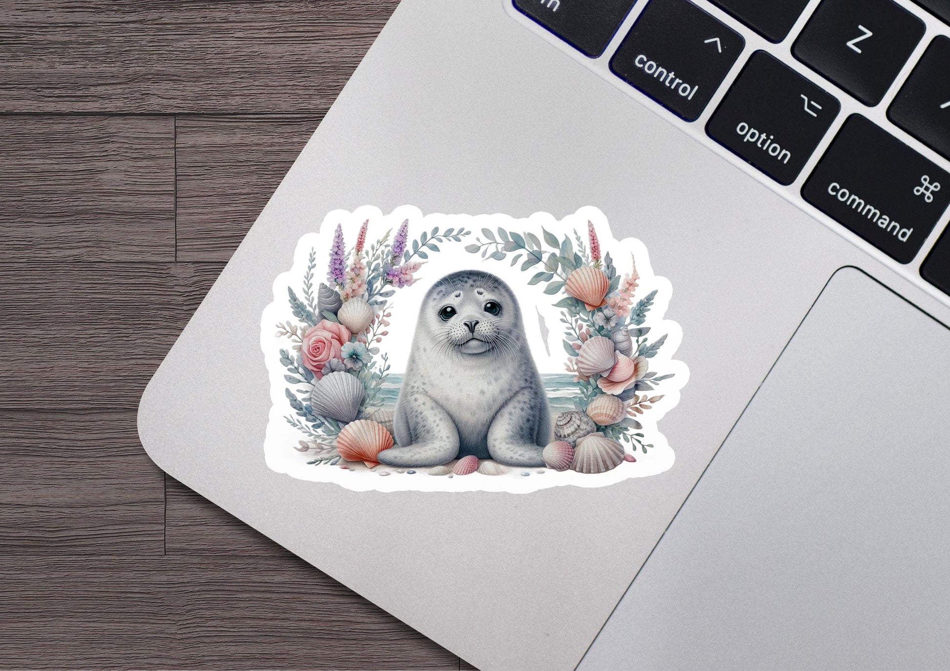 a sticker of a seal sitting on top of a laptop