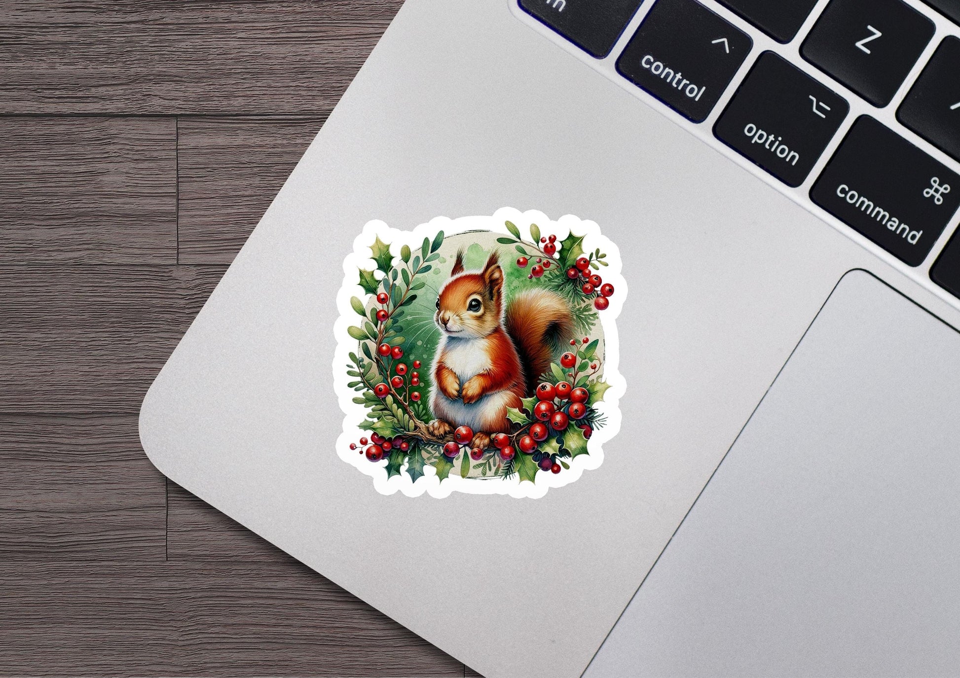 a sticker of a red squirrel sitting on a tree branch