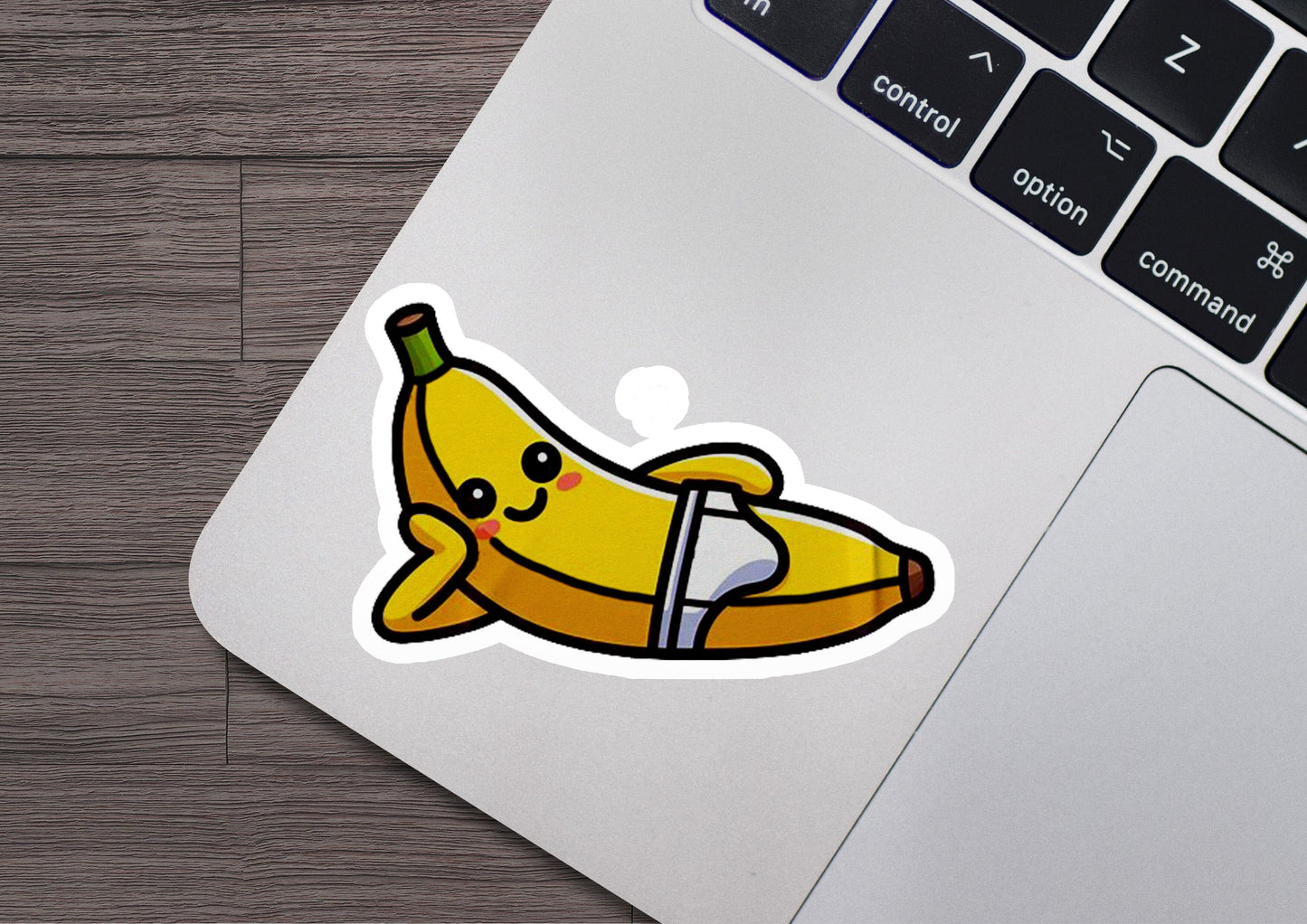 a sticker of a banana on a laptop