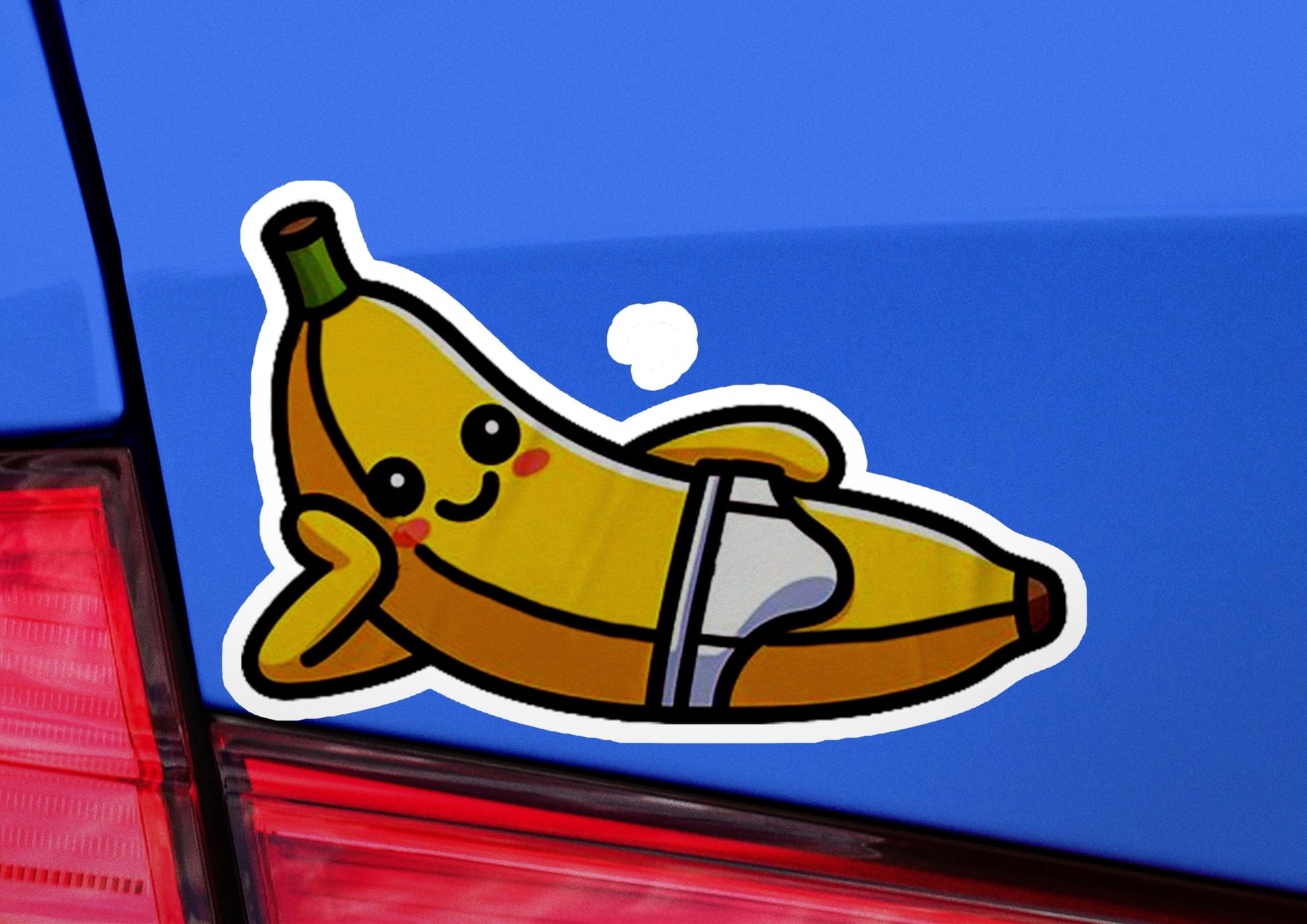 a sticker of a banana on the back of a car