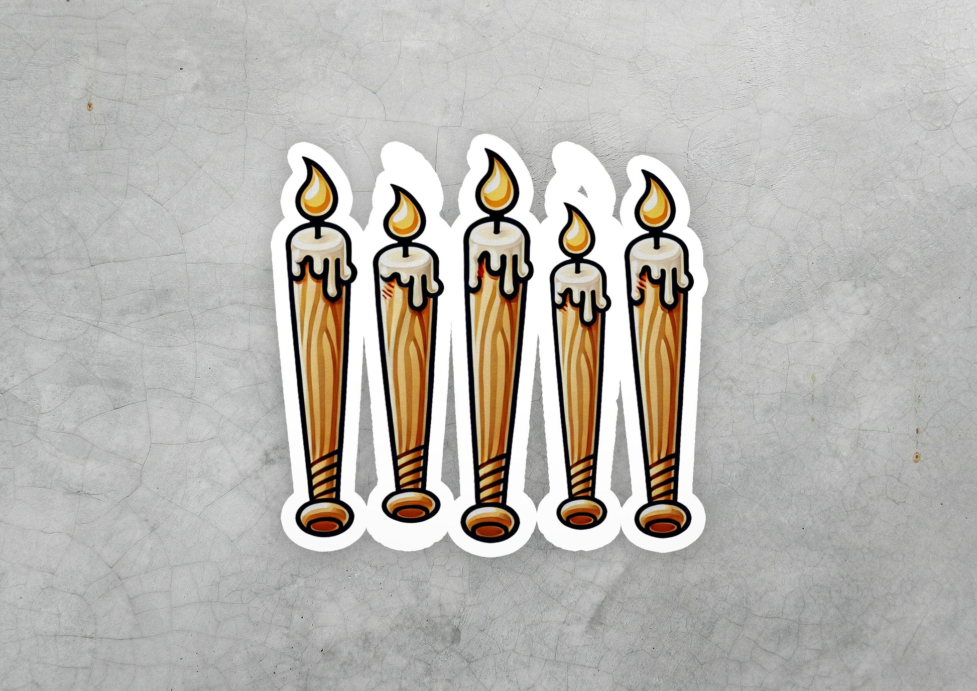 a sticker of a row of lit candles