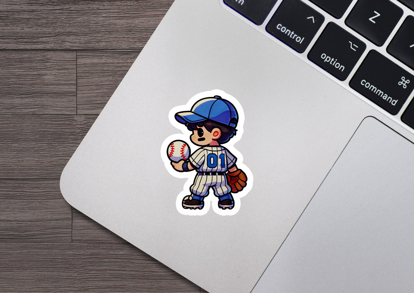 a laptop with a sticker of a baseball player