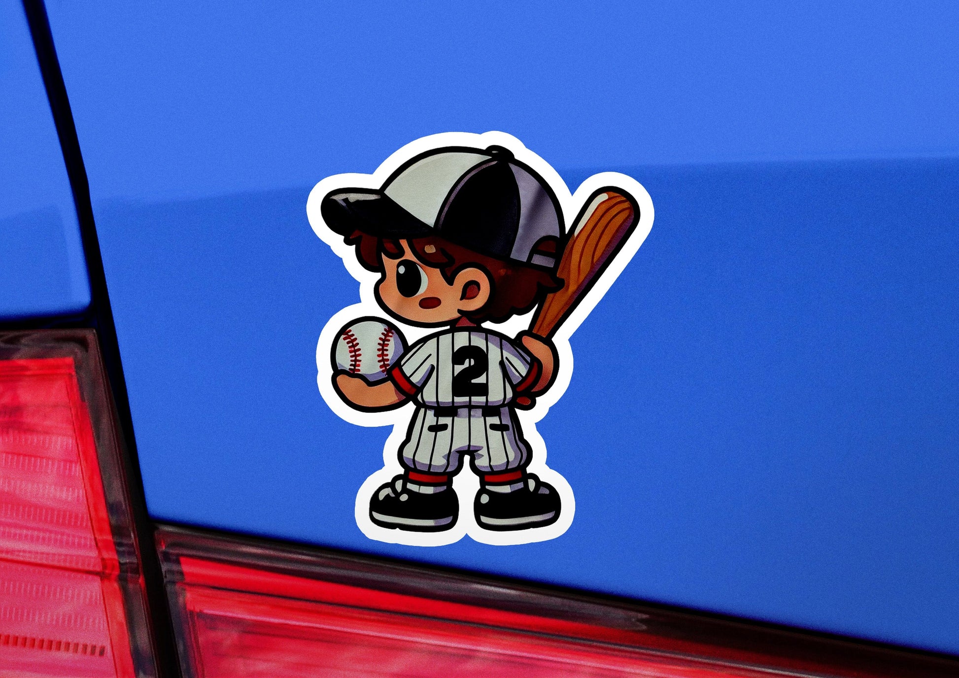 a baseball player sticker on the back of a car