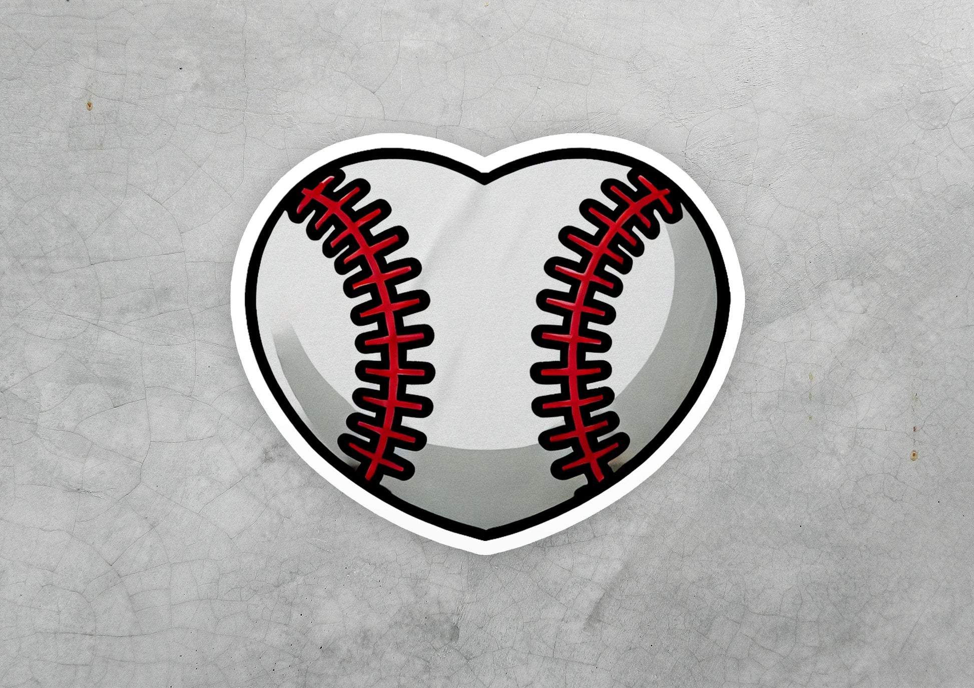 a heart shaped sticker with a baseball inside