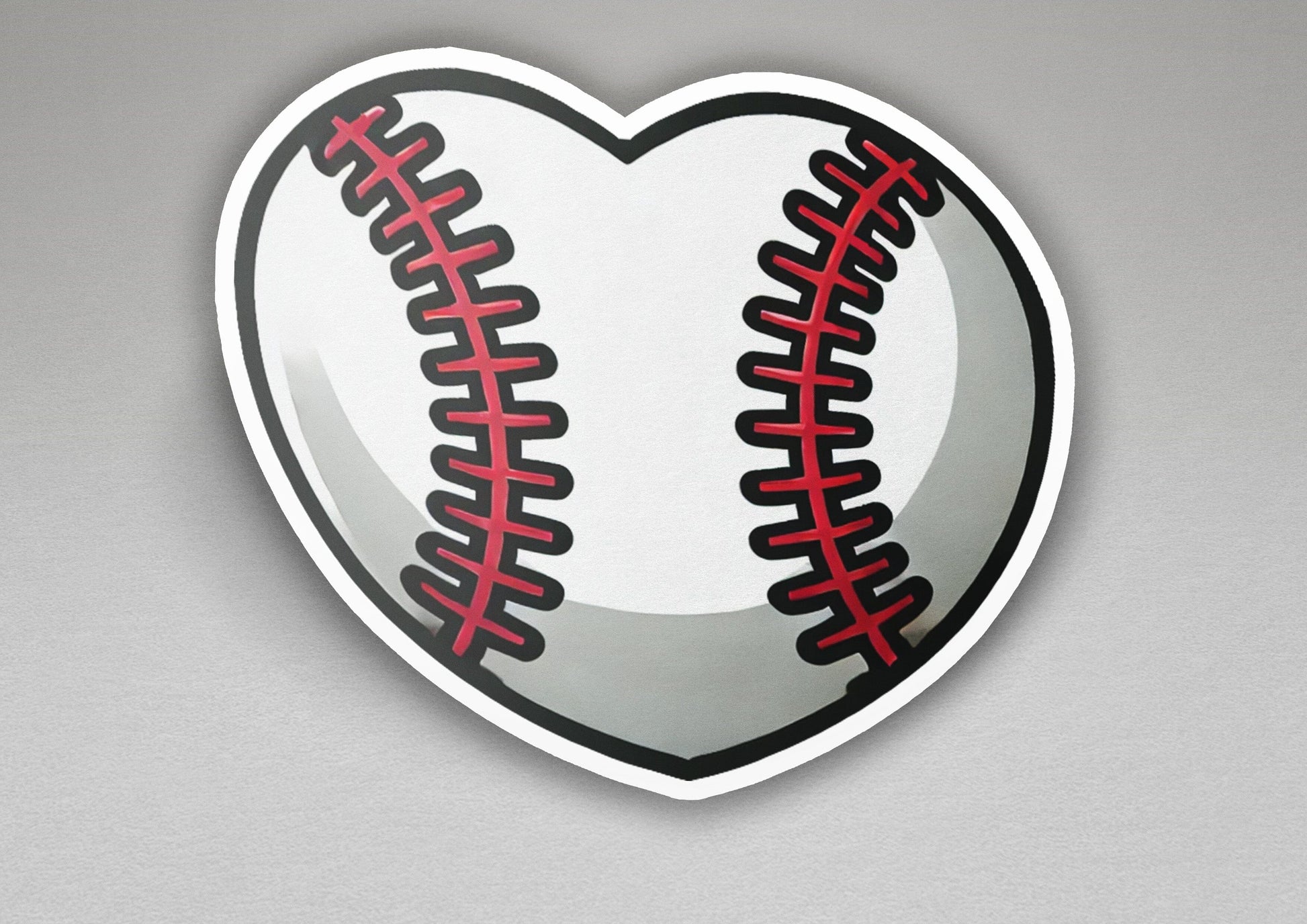 a heart shaped sticker with a baseball on it