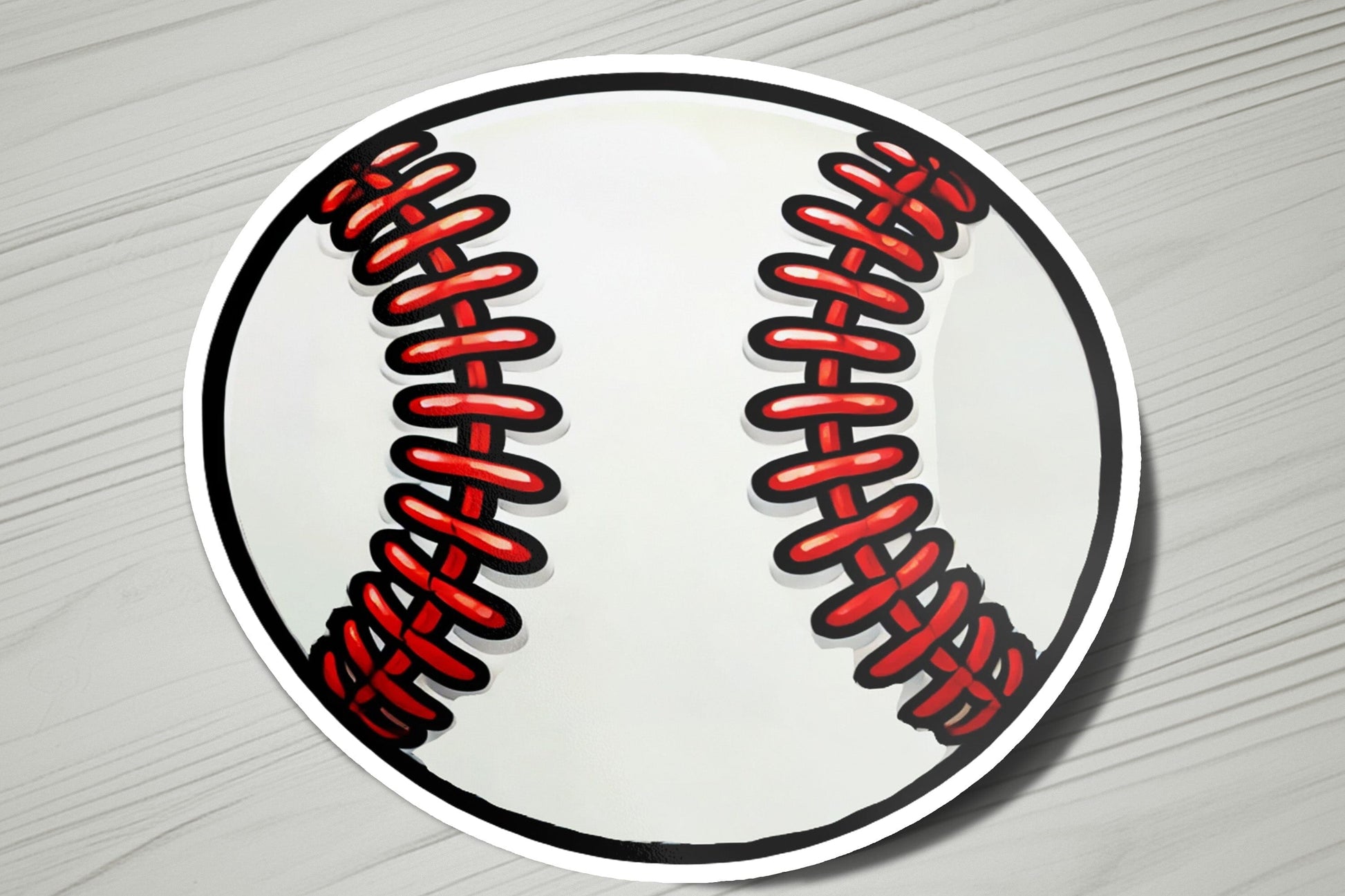 a sticker of a baseball with red stitchs
