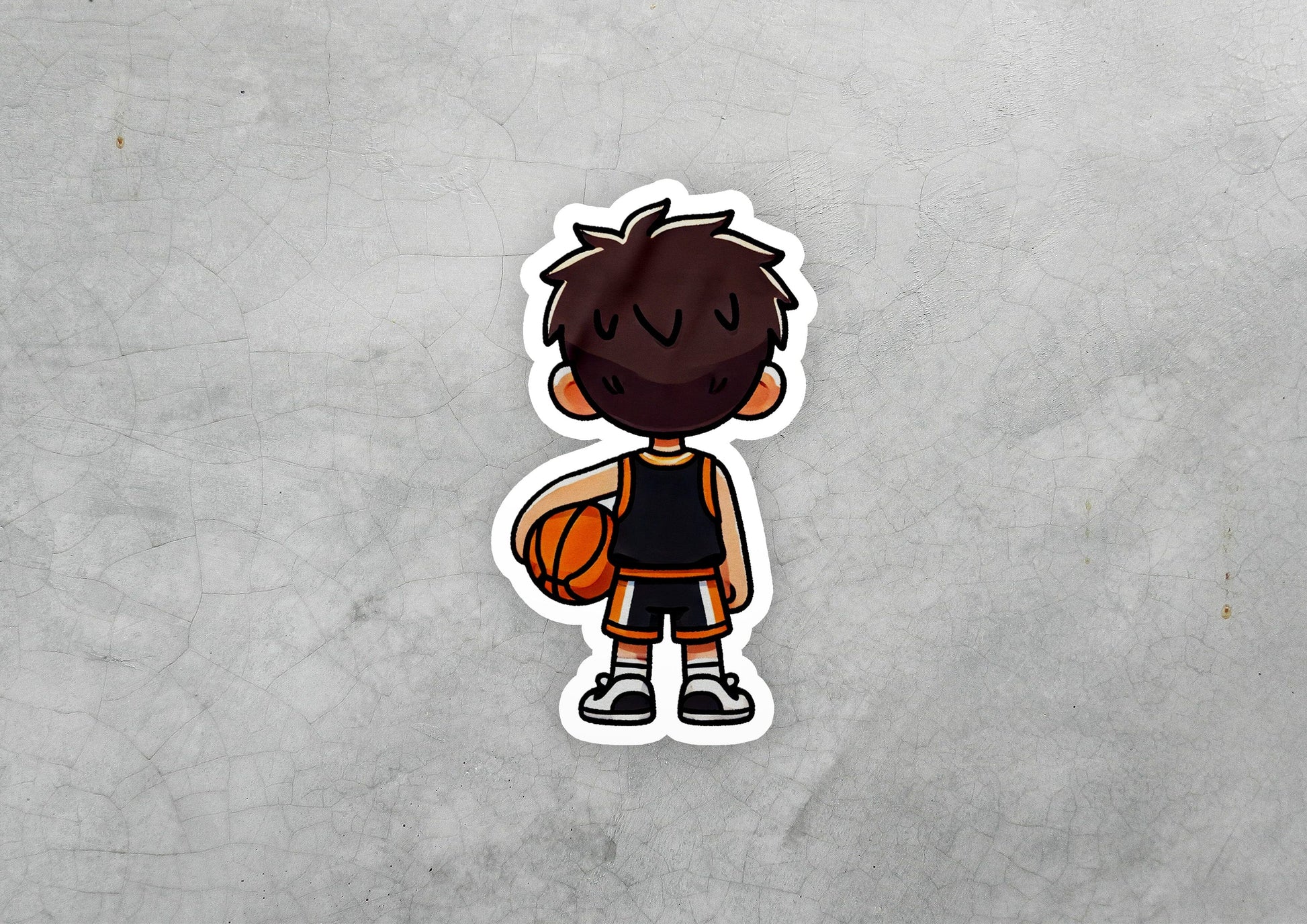 a sticker of a boy holding a basketball