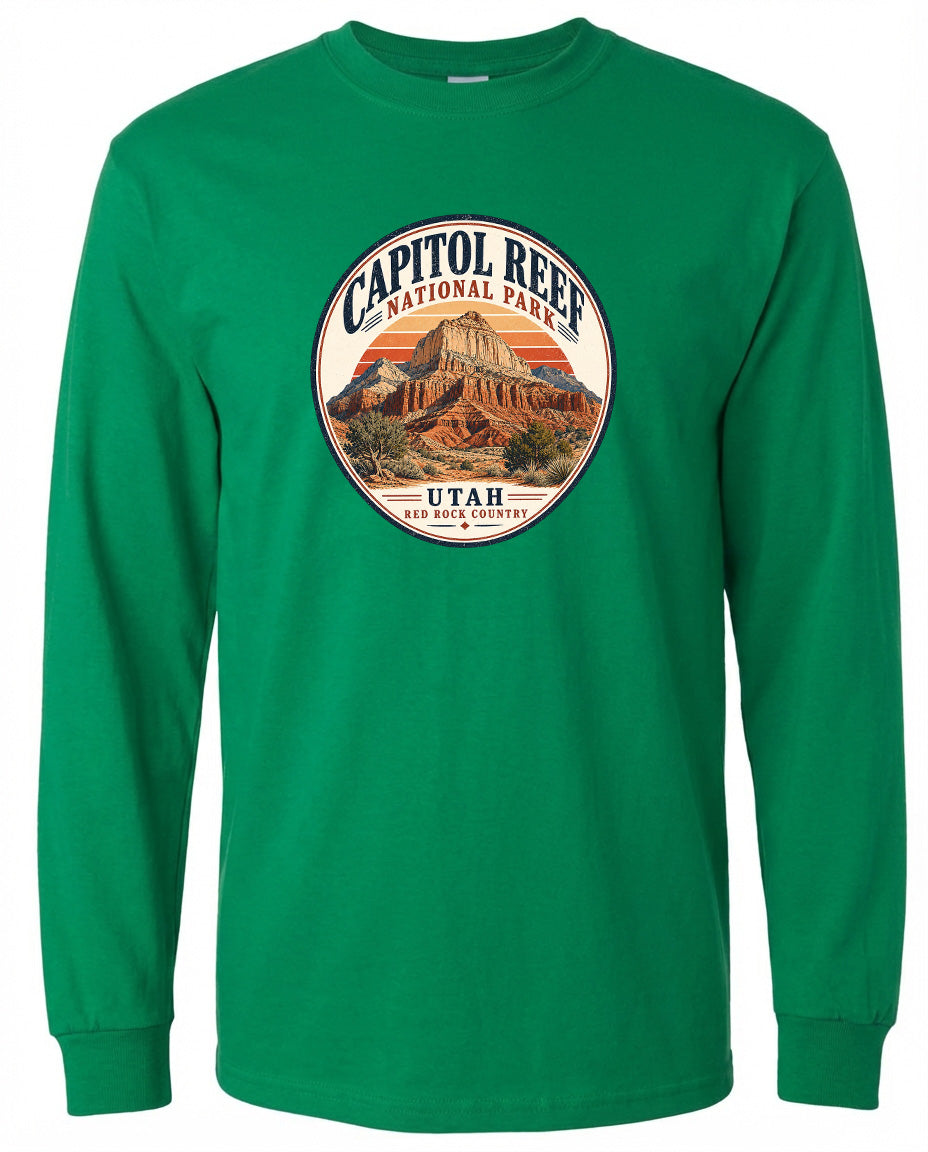 A green long-sleeved t-shirt with a circular graphic design featuring the Capitol Reef National Park in Utah.