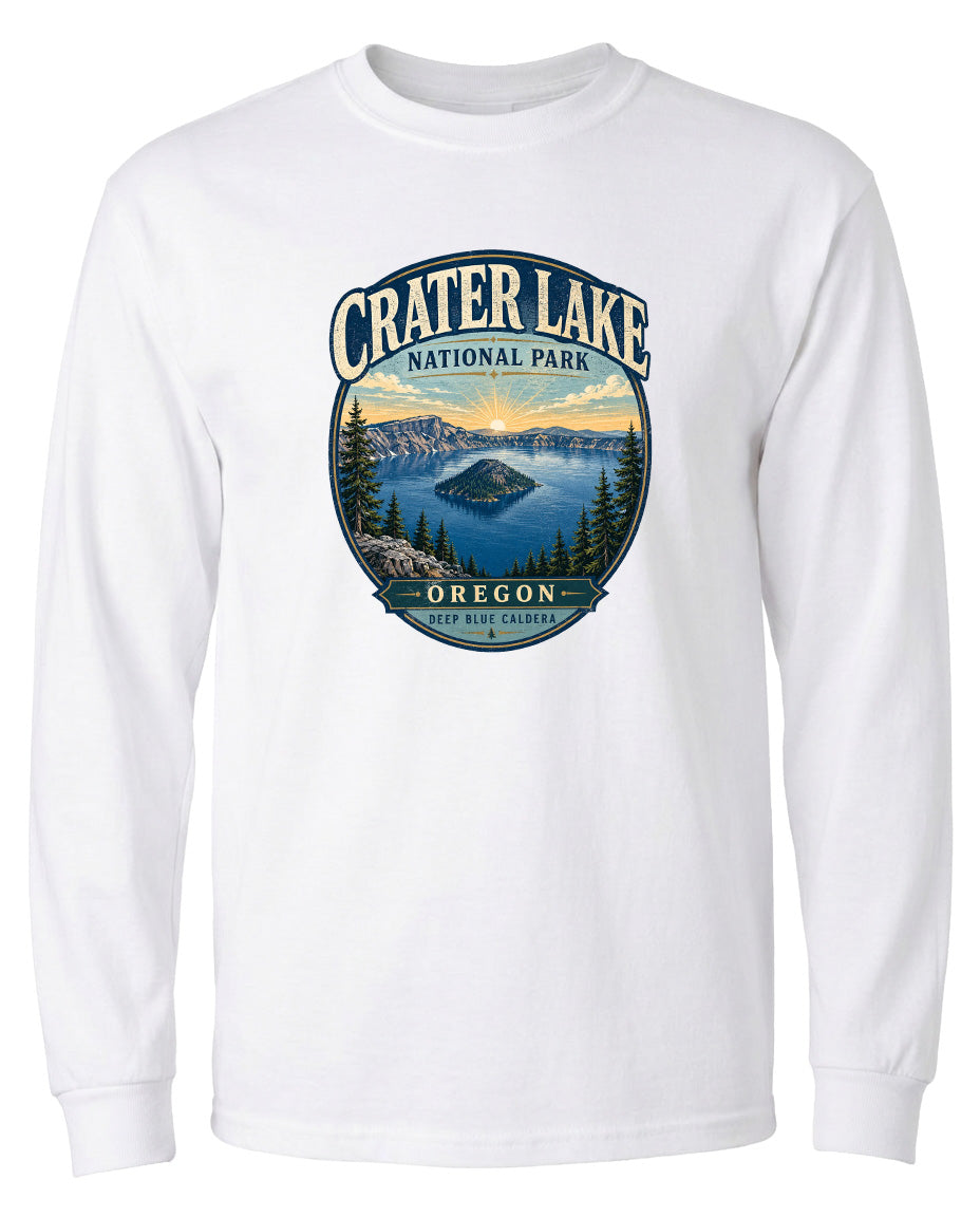 A white long-sleeved t-shirt with a graphic design depicting Crater Lake National Park in Oregon.
