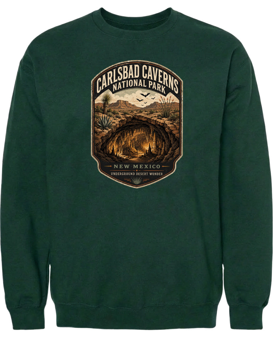 A green sweatshirt with a graphic design depicting the Carlsbad Caves National Park in New Mexico.