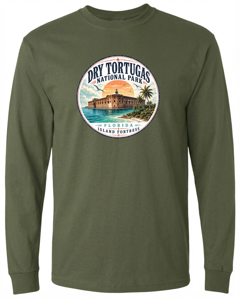 A circular graphic on a green long-sleeved shirt, depicting a tropical island with a building and palm trees.