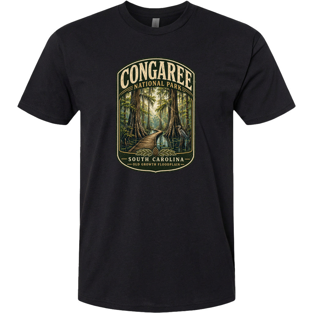 A black t-shirt with a graphic design depicting a forest scene with a path leading through it.