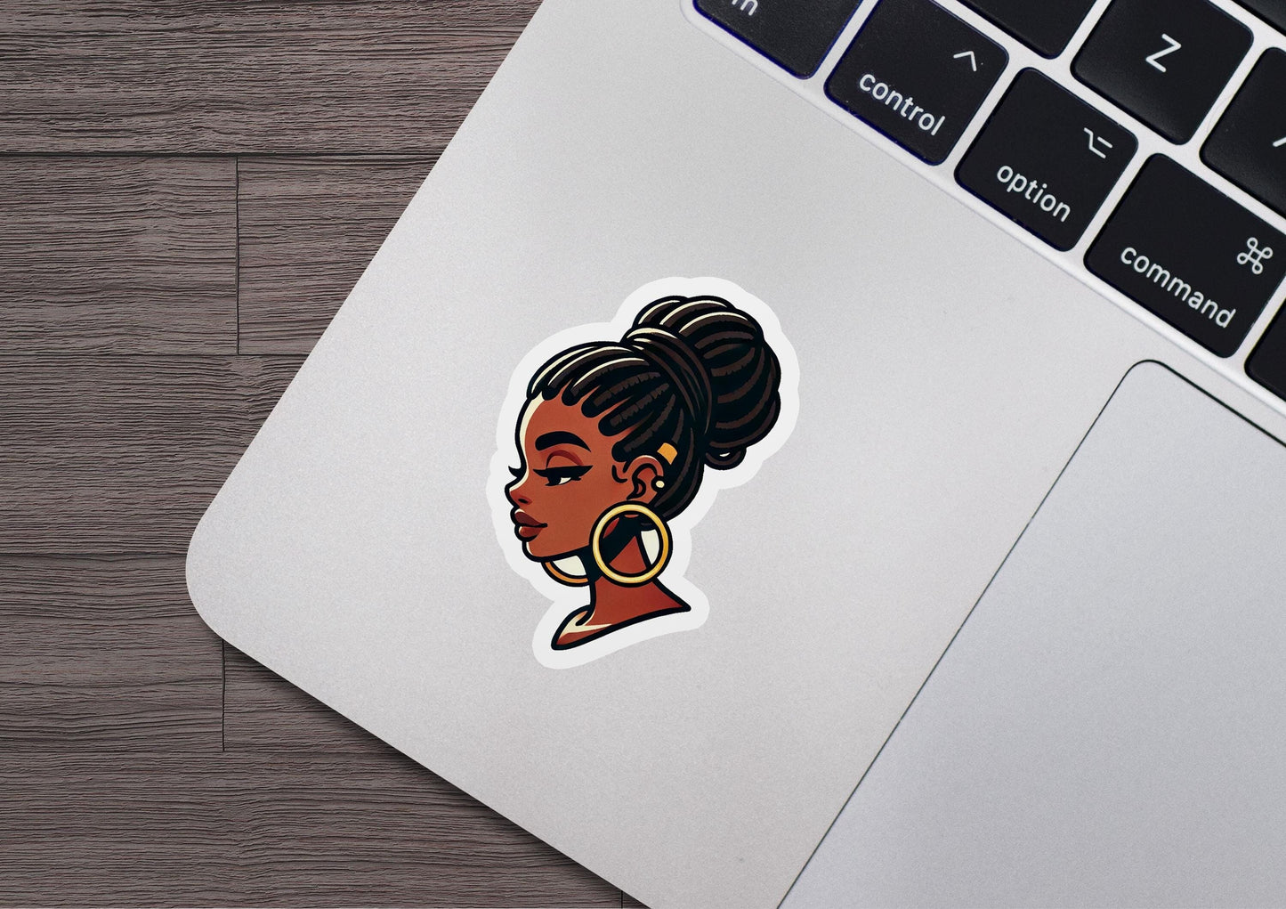a laptop with a sticker of a woman's face
