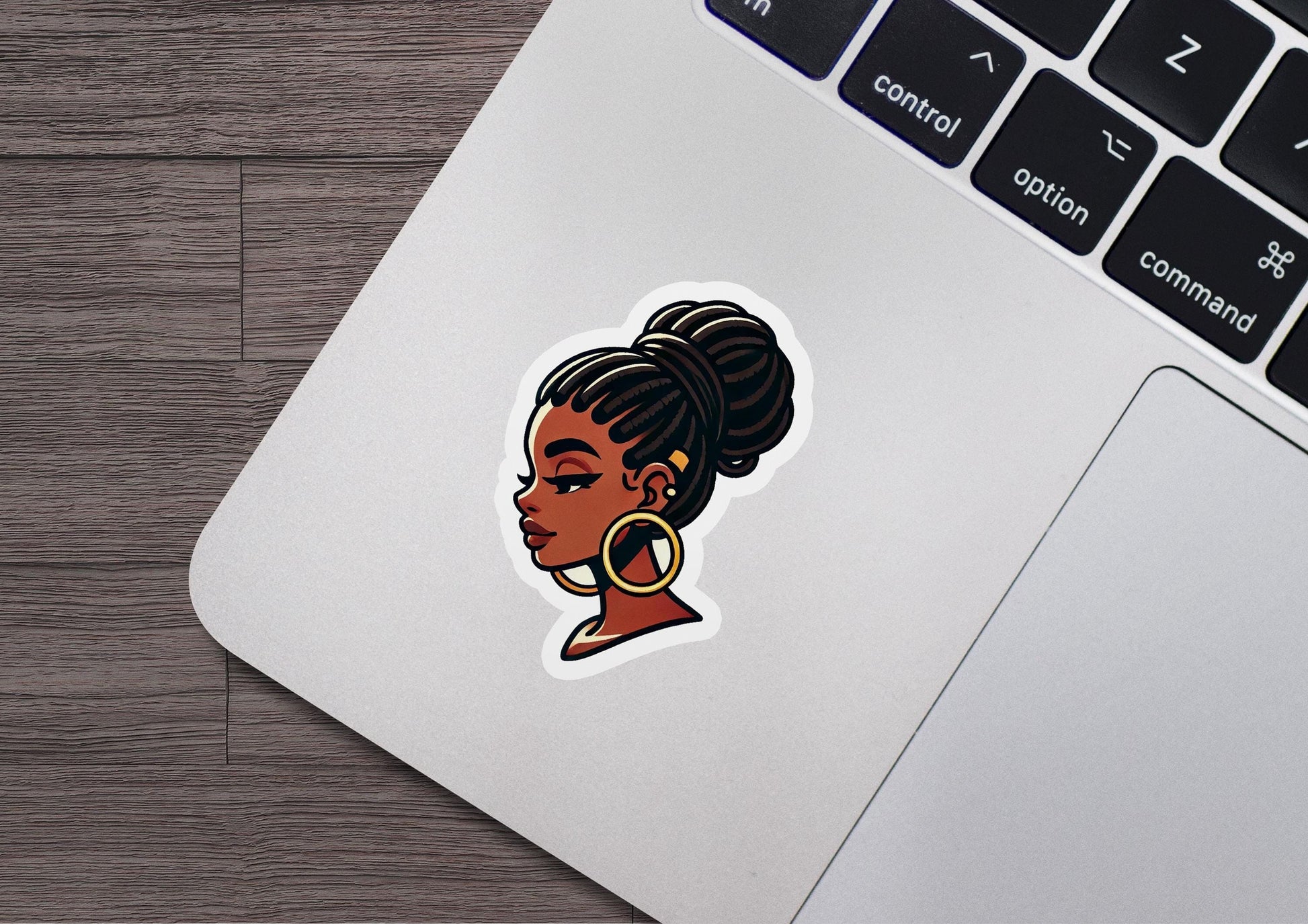 a laptop with a sticker of a woman's face