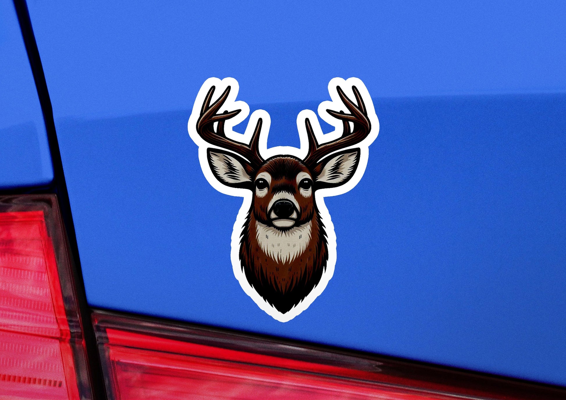 a sticker of a deer's head on the back of a car
