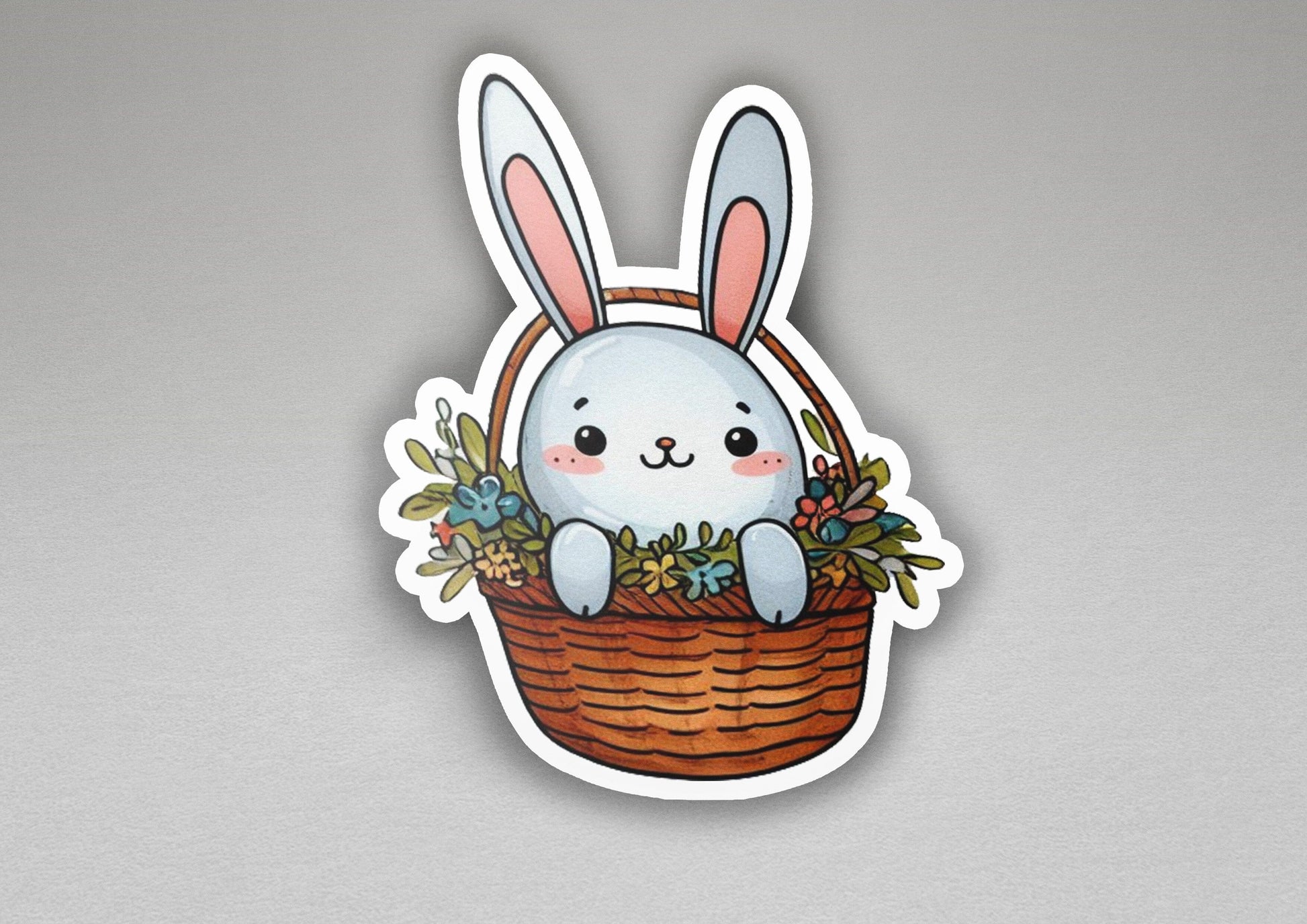 a sticker of a bunny sitting in a basket
